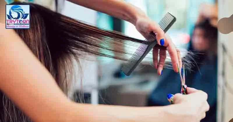 Expert hairstylist demonstrating hair cutting techniques in Bhubaneswar